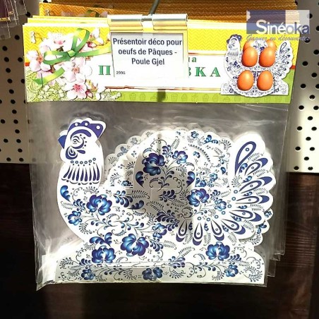 Joli présentoir pour œufs de Pâques réalisé en carton imprimé avec une forme de Poule et des motif Gjel. Emballage à plat.